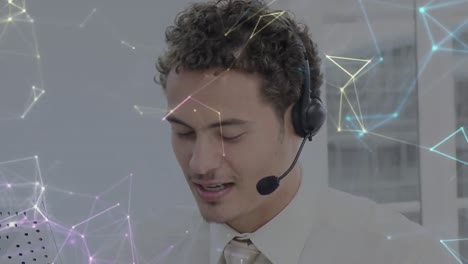 Animation-of-network-of-connections-over-businessman-with-headset-in-office