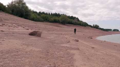 Man-running-on-a-beach-slow-motion