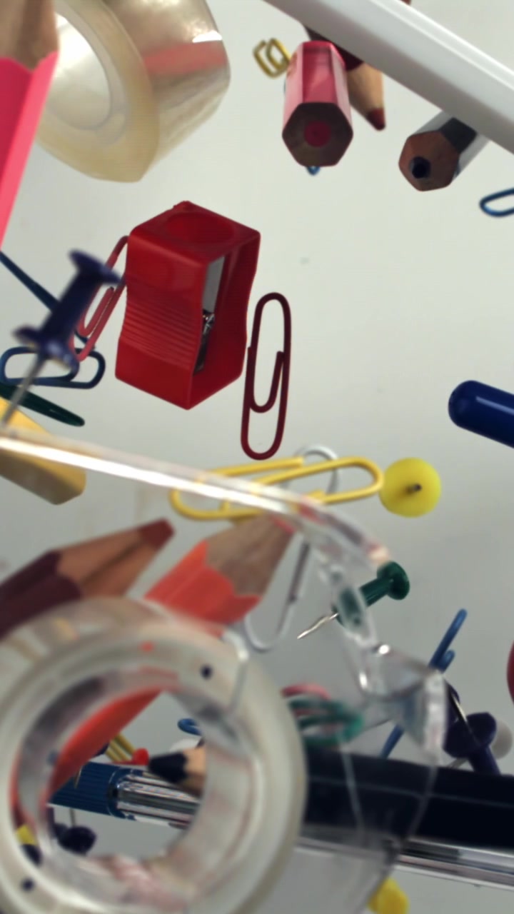 Colorful Office and Art Supplies Floating Against a White Background