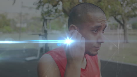 animation of glowing light and connections over biracial man with earphones exercising