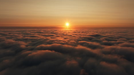 sunrise or sunset above the clouds