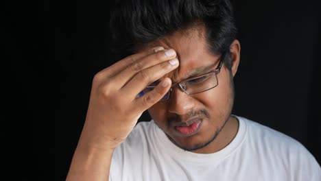 man experiencing a headache