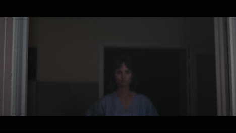 a girl runs through strange corridors of abandoned hospital