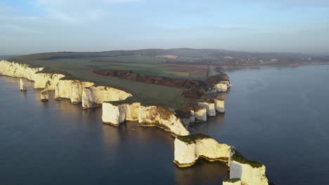 Old-Harry-Rocks-cliffs-and-green-English-countryside,-Dorset-in-England