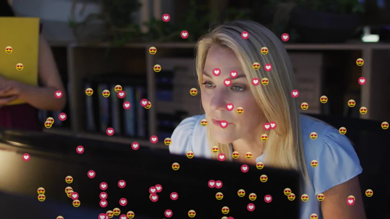 Office woman tracking marketing post after posting, receiving heart emojis covering screen