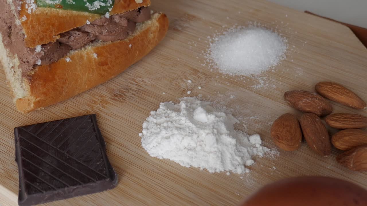 Rosco de Reyes ingredients on a wooden board, festive holiday preparation