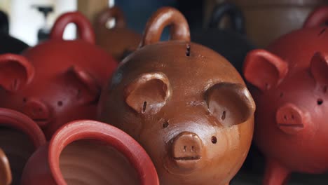 beautiful handmade crafts with piggy bank in local town of pomaire market, santiago de chile