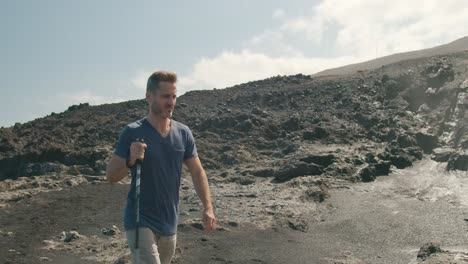 male traveler walking near blowhole