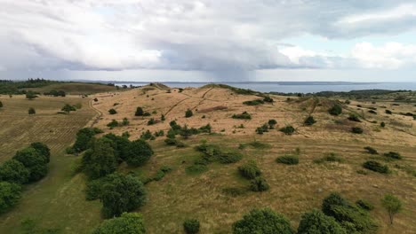 Aerial-of-Trehøje-Mols-Bjerg-Hills-with-Sea,-Denmark