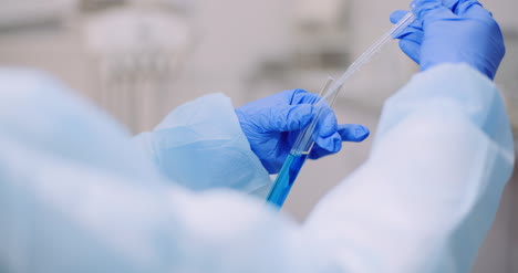 Portrait-Of-Female-Scientist-Analyzing-With-A-Pipette-At-Laboratory-1