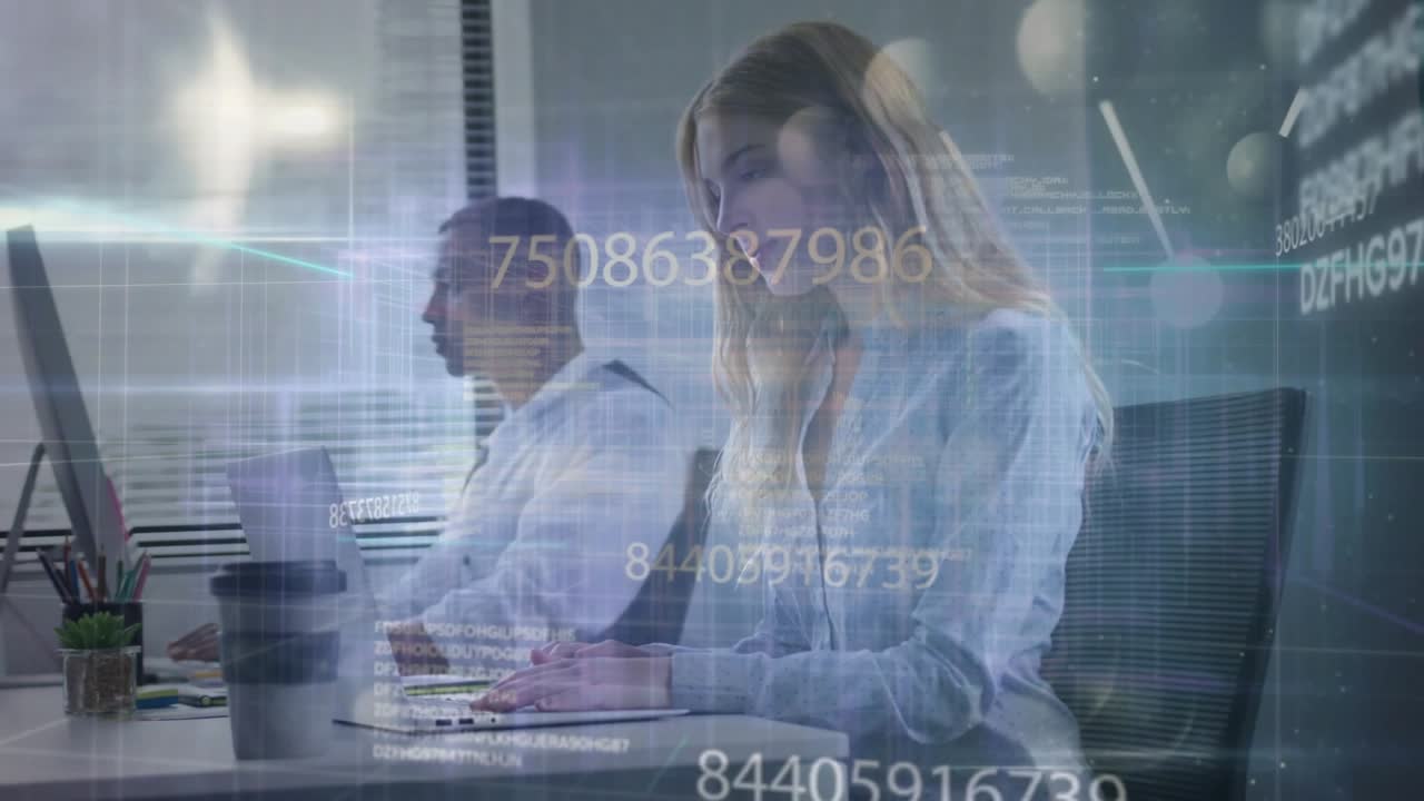 Business colleagues typing on laptop and desktop in office, causing live data overlays animating