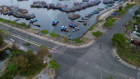 blue asian fishing boats moored in danang harbour in vietnam pan up