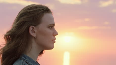 portrait-of-beautiful-young-woman-enjoying-peaceful-seaside-at-sunset-exploring-spirituality-contemplating-future