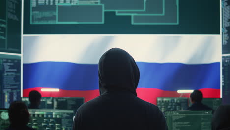 dishonest person in a russian cyber security room hacking systems