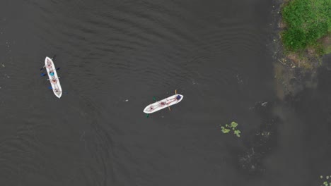 aerial view of two kayaks on a calm river