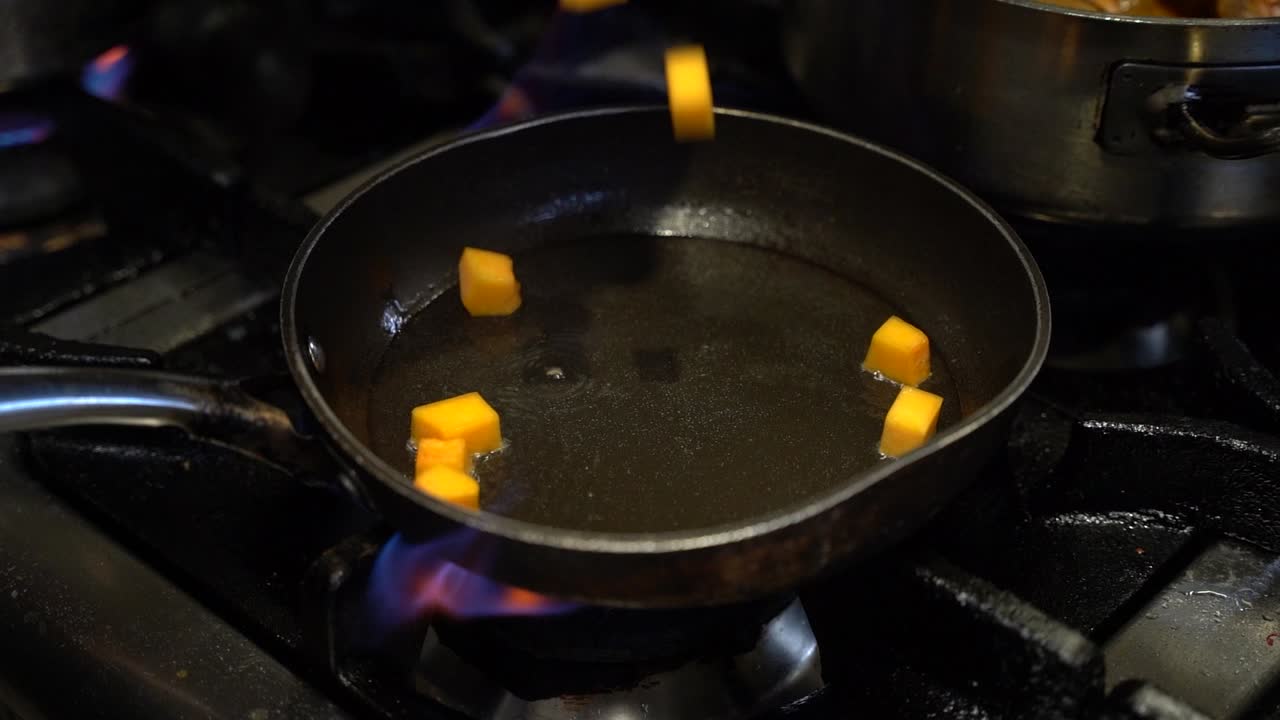 Cooking carrots in a steaming cooking pan in slow motion