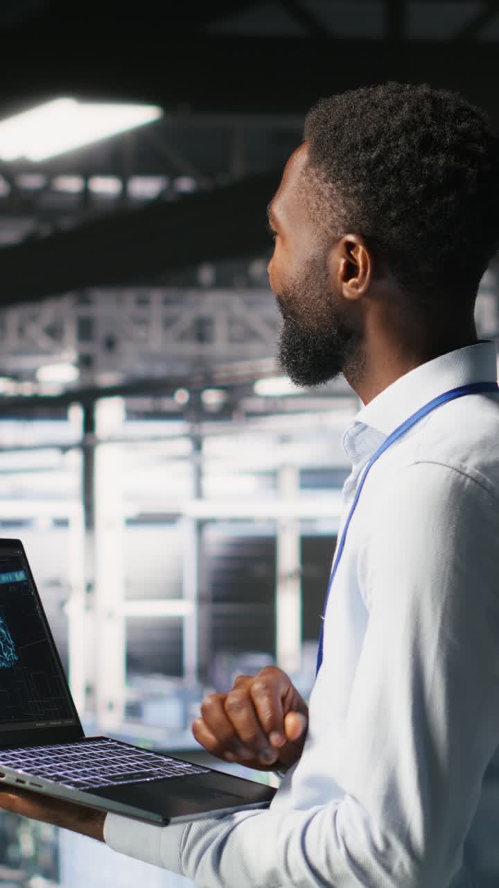 Vertical video Programmer and colleague in data center reviewing AI LLM visualizations