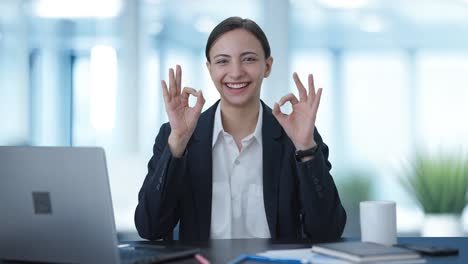 happy indian business woman showing okay sign