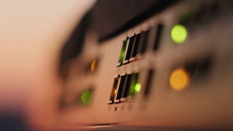 abstract close-up of glowing indicator lights on electronic equipment