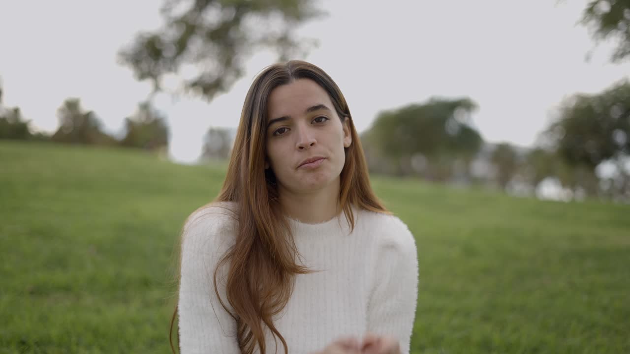 Woman clapping in a park