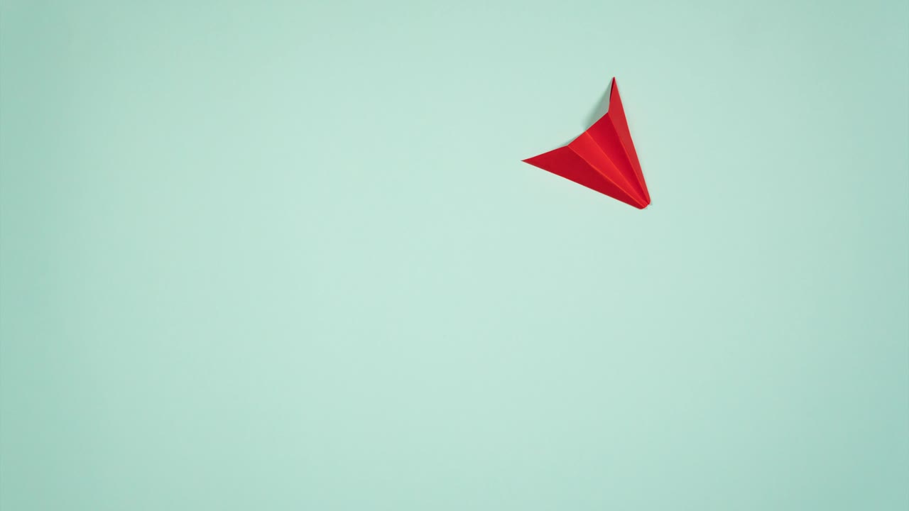 Paper airplanes flying over a sky with clouds and birds and takeoff. Stop motion animation