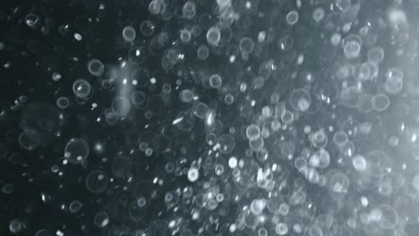 bokeh de partículas abstractas flotantes sobre fondo oscuro