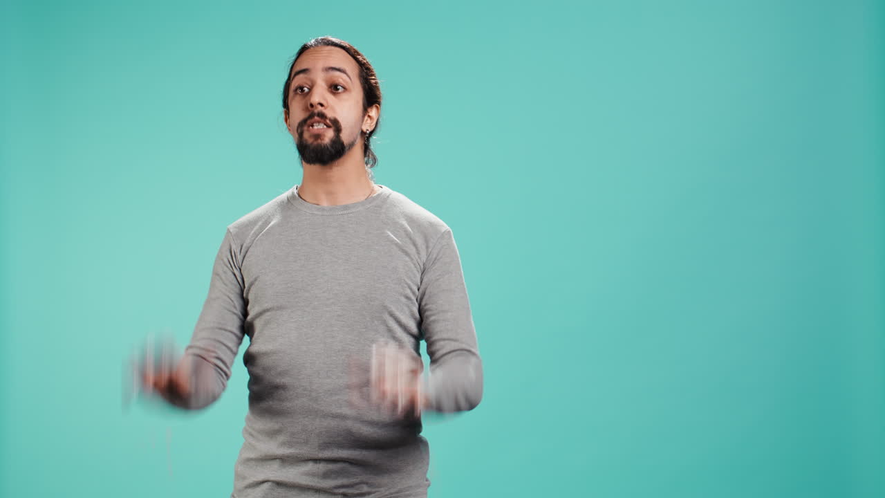 Assertive man doing stop hand gesture sign