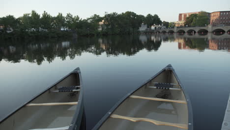 Canoes-at-dusk-on-the-Charles-River-in-Waltham,-MA