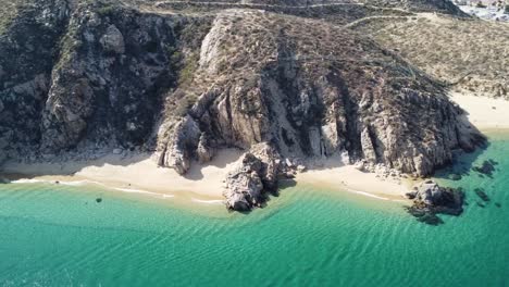 White-sandy-beaches,-boats,-and-turquoise-waters-at-Cabo-San-Lucas