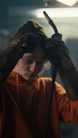 welder adjusting safety gear