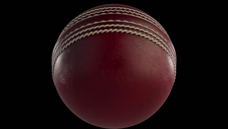 red cricket ball spinning