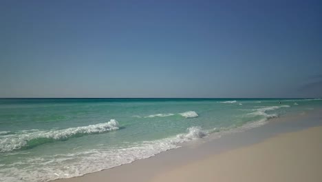 Flying-over-the-ocean-water-on-a-clear-and-sunny-day