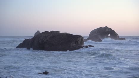 tides strongly crashing on the rocks