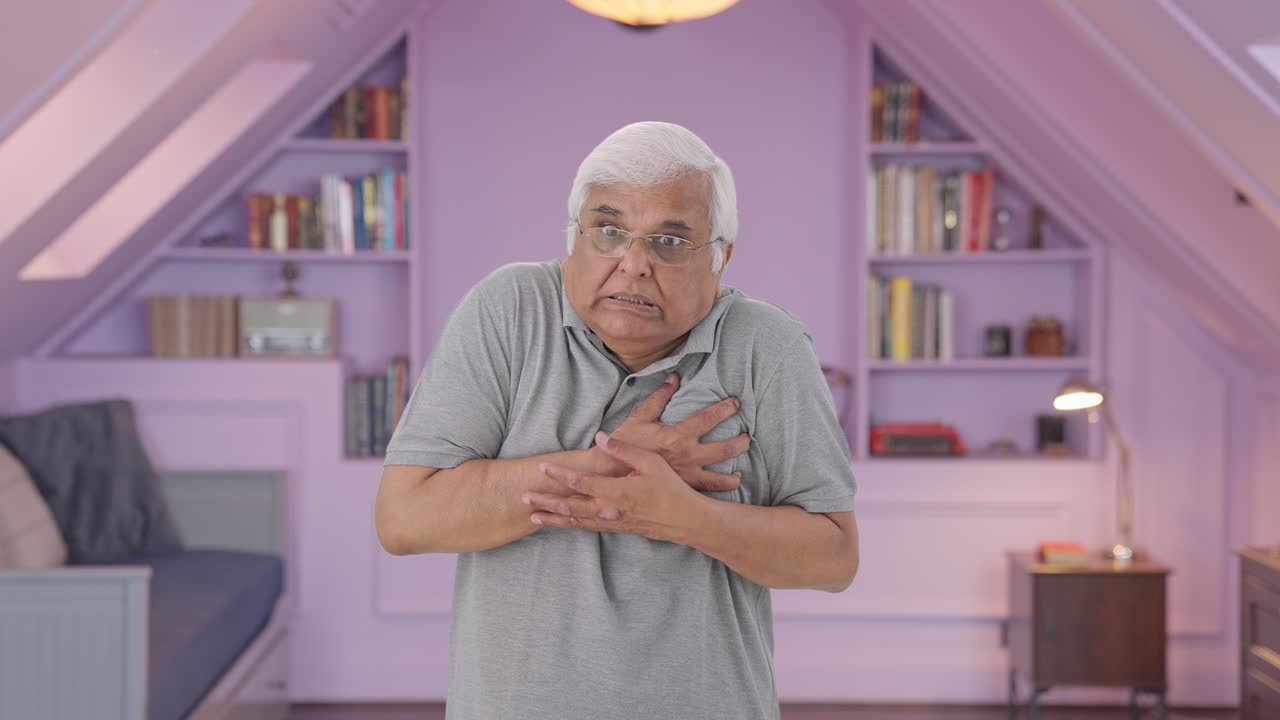 Sick Indian old man having a heart attack