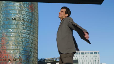 businessman jumping after successful meeting