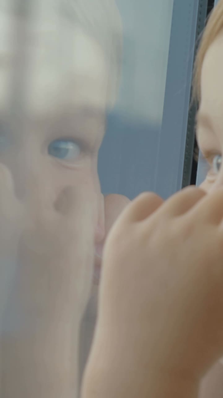 Child Looking out Window