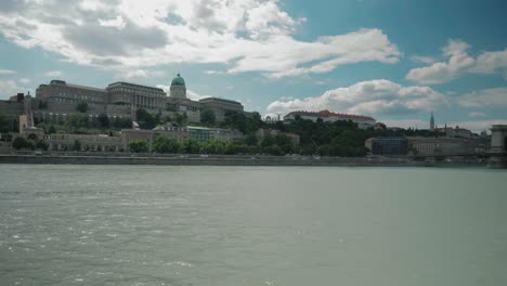 Boat-ride-through-Danube,-summer-afternoon-passing-by-budacastle