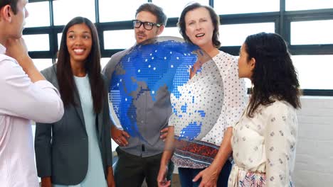 animation of rotating globe over happy group of diverse business colleagues talking in office