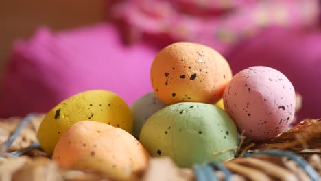 colorful pastel easter eggs in a nest