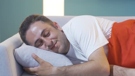 man smiling while sleeping.