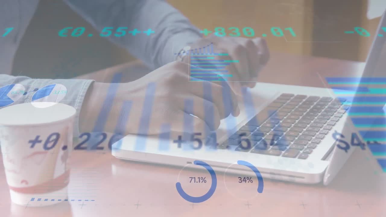 Animation of financial data and graphs moving over hands of biracial man using laptop