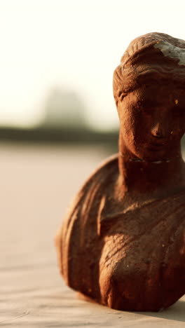 rusty bronze bust of a woman