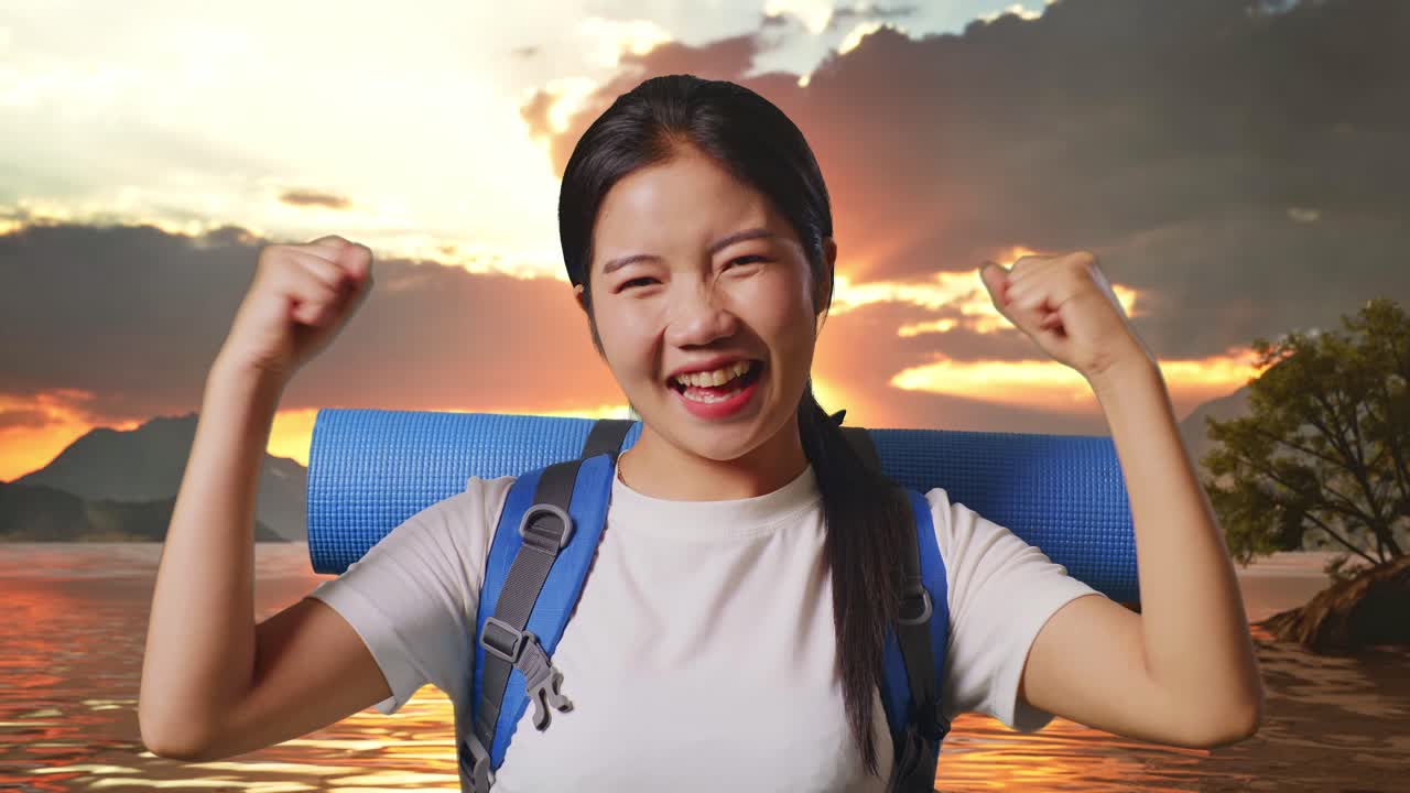 Close Up Of Asian Female Hiker With Mountaineering Backpack Screaming Goal Celebrating The Success At A Lake
