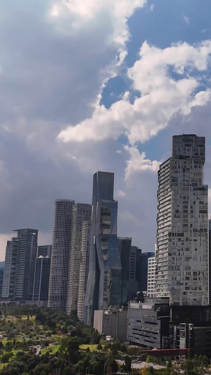 Vertical drone shot soaring over Santa Fe's skyscrapers, CDMX