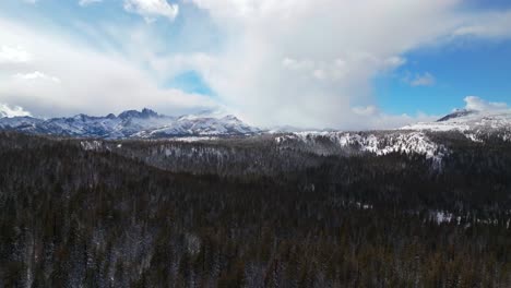 winter spring mammoth mountain ski resort california hemlocks ritter range sierra nevadas minarets summit vista sunny blue sky snowy gray clouds over jagged peaks inyo sierras national forest forward