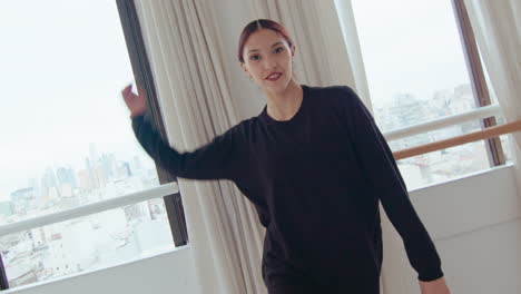 smiling girl approaching the camera and performing contemporary dance
