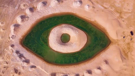 aerial view of the artificial eye lake in the tengger desert, inner mongolia autonomous region, china