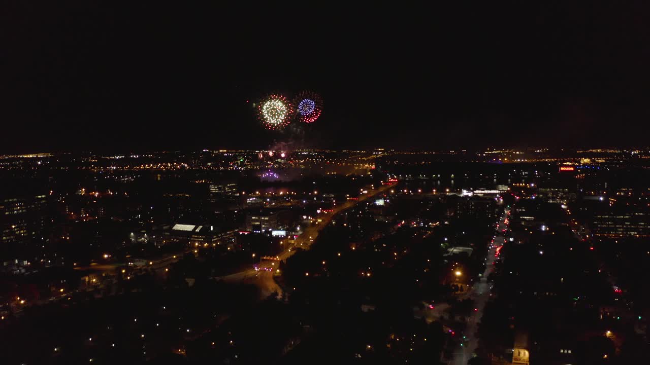 Aerial view of a firework show on a nice summer night in Montreal