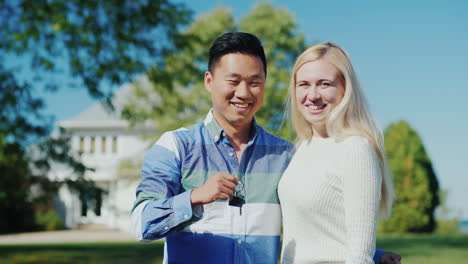 happy couple with house key