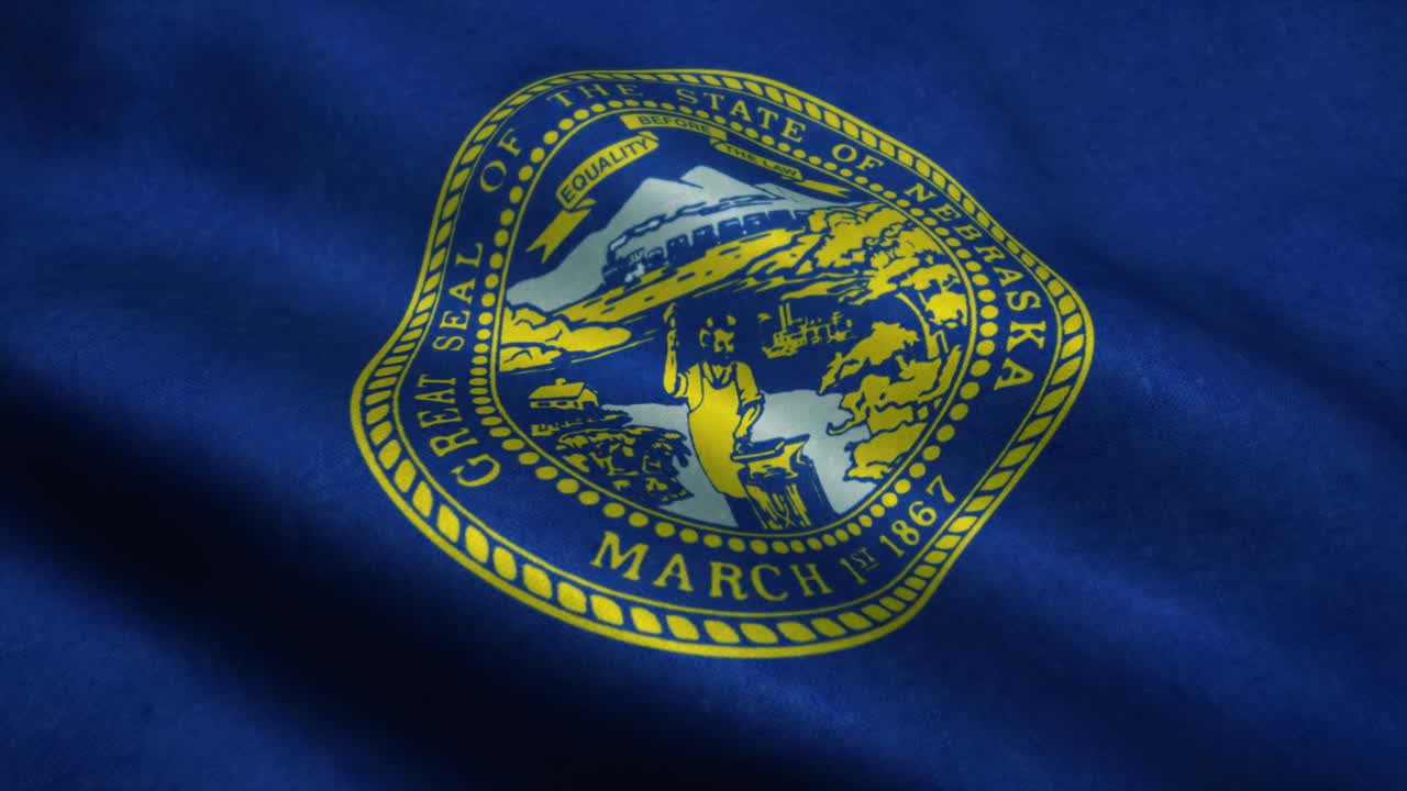 la bandera estatal de nebraska ondeando en el viento. la bandera nacional de nebraska. el signo del estado de nebraska animación de bucle sin costuras. 4k